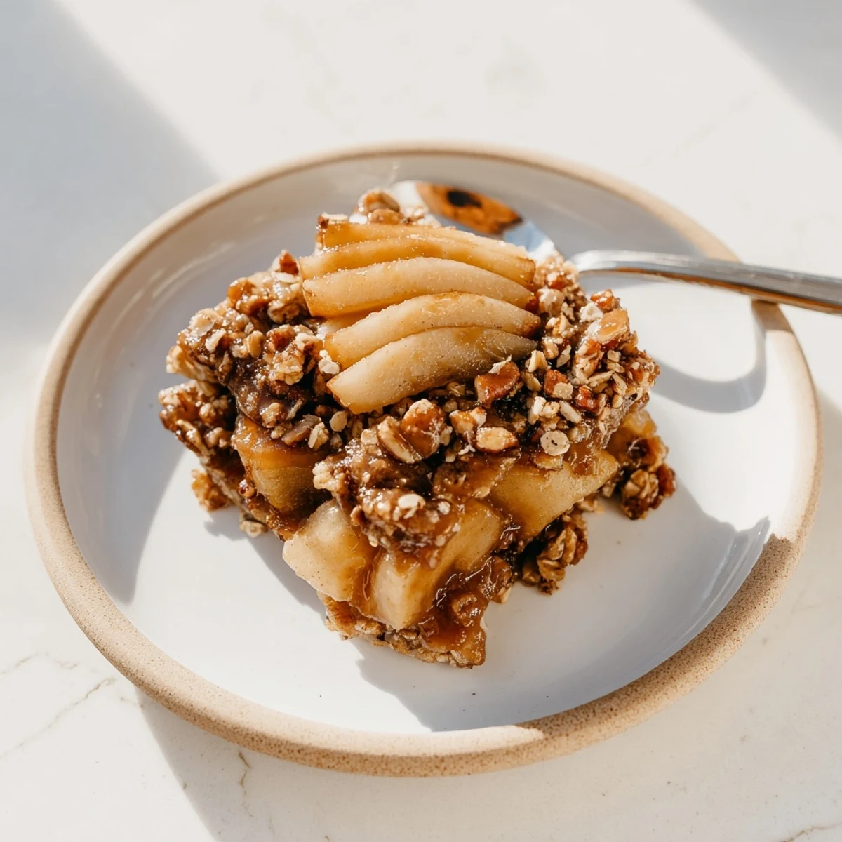 Warm apple slices drenched in sweet maple bourbon caramel and crunchy oat topping.  