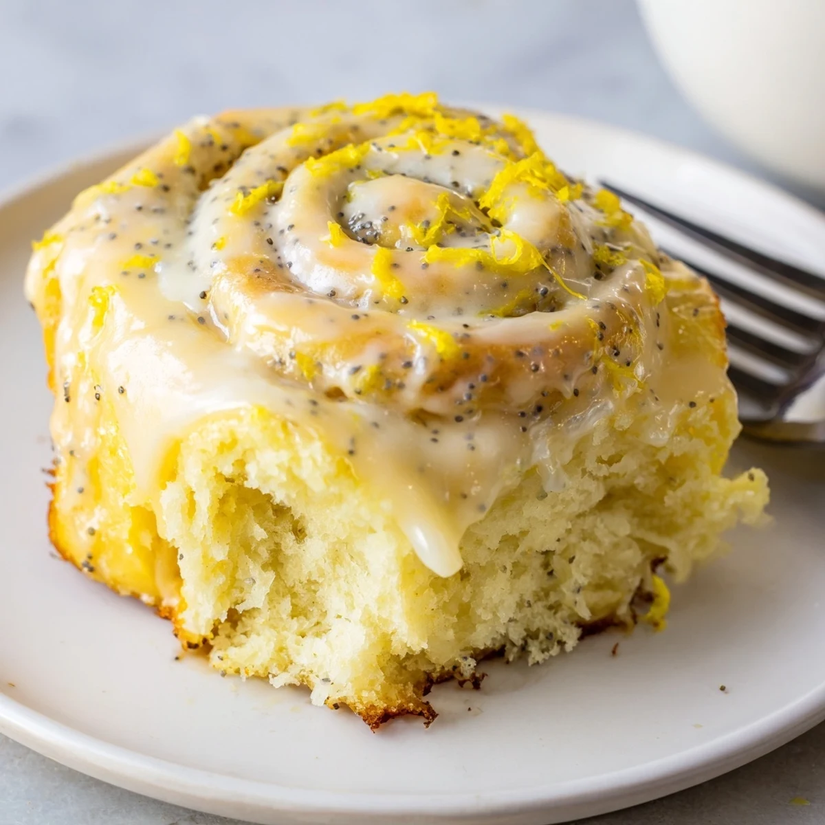Soft, fluffy lemon rolls drizzled with sweet lemon icing for breakfast bliss.  
