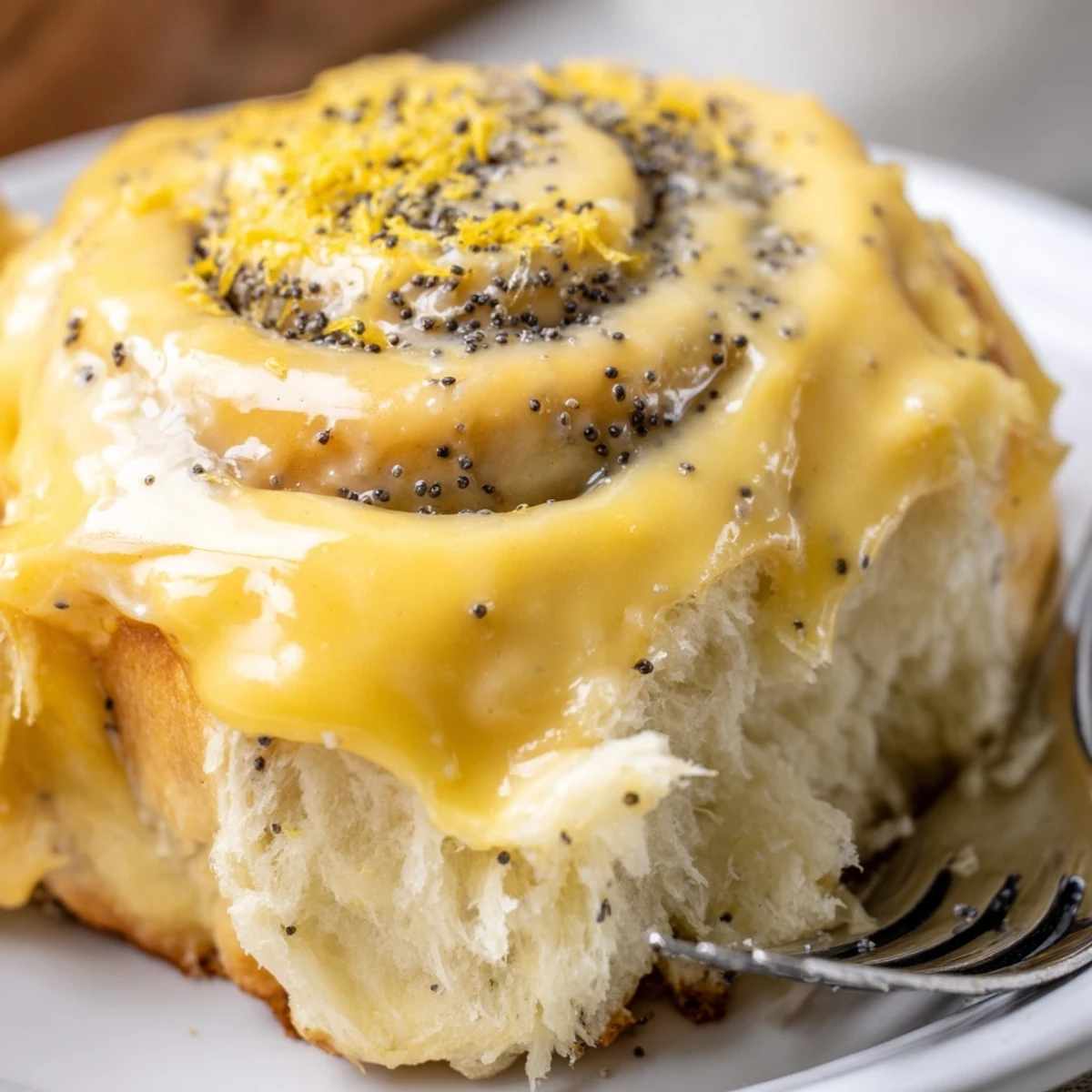 Freshly baked lemon rolls, oozing sweetness and crowned with zesty icing delight.