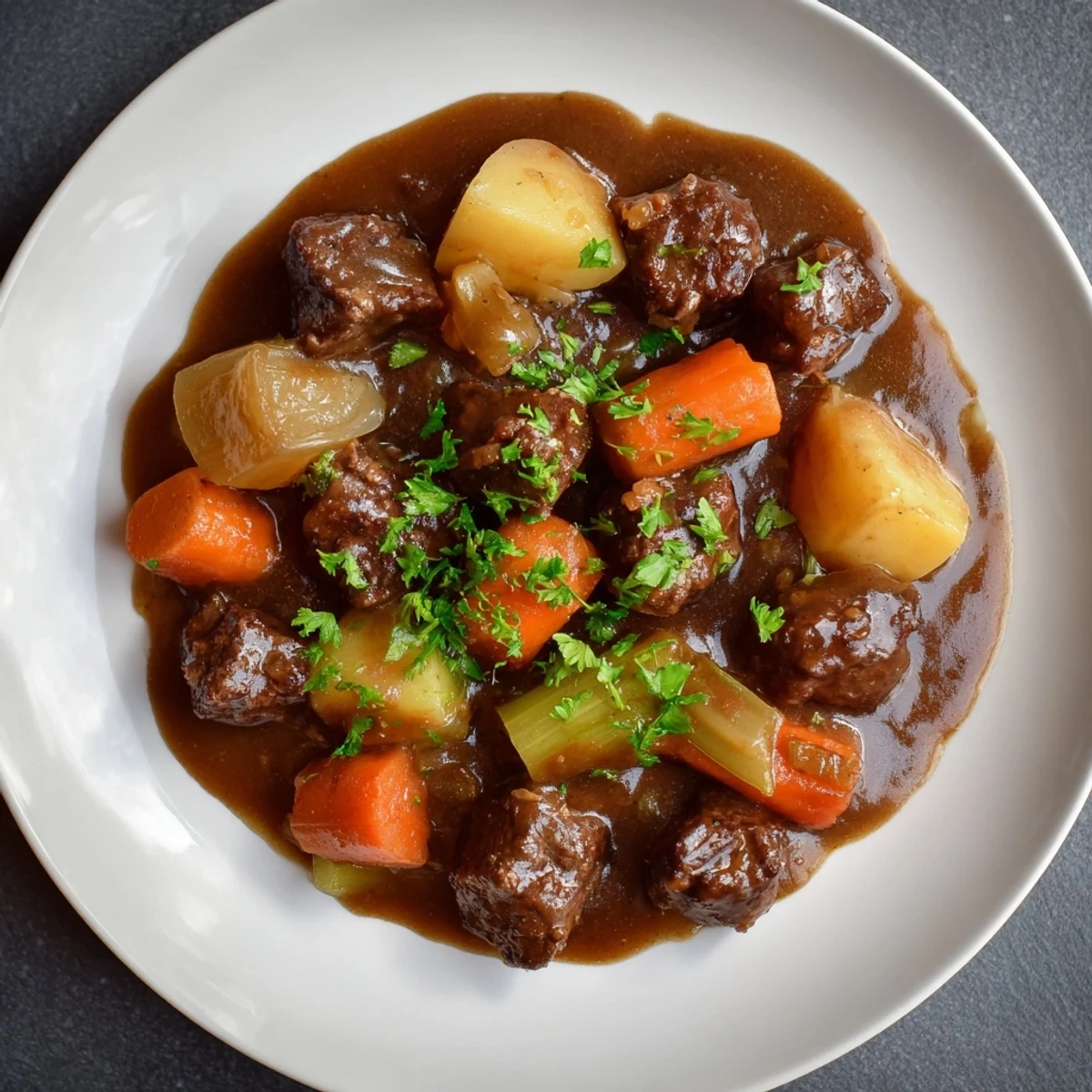 Tender Instant Pot Beef Stew with root vegetables, steaming hot and ready to eat, served in bowls.