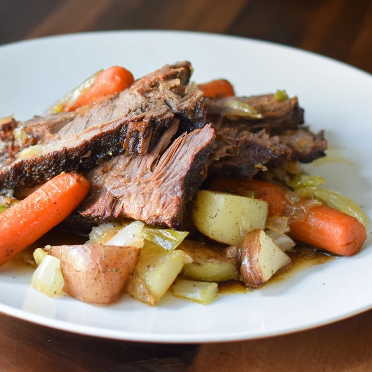 Forkful of juicy Pickle Brine Pot Roast over mashed potatoes, showcasing the deliciousness of this meal.