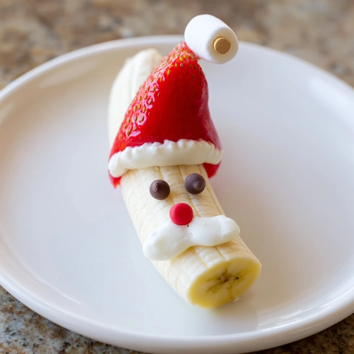 Enjoy these colorful Banana Strawberry Santa Skewers; the image details a simple, eye-pleasing arrangement for a festive appetizer.