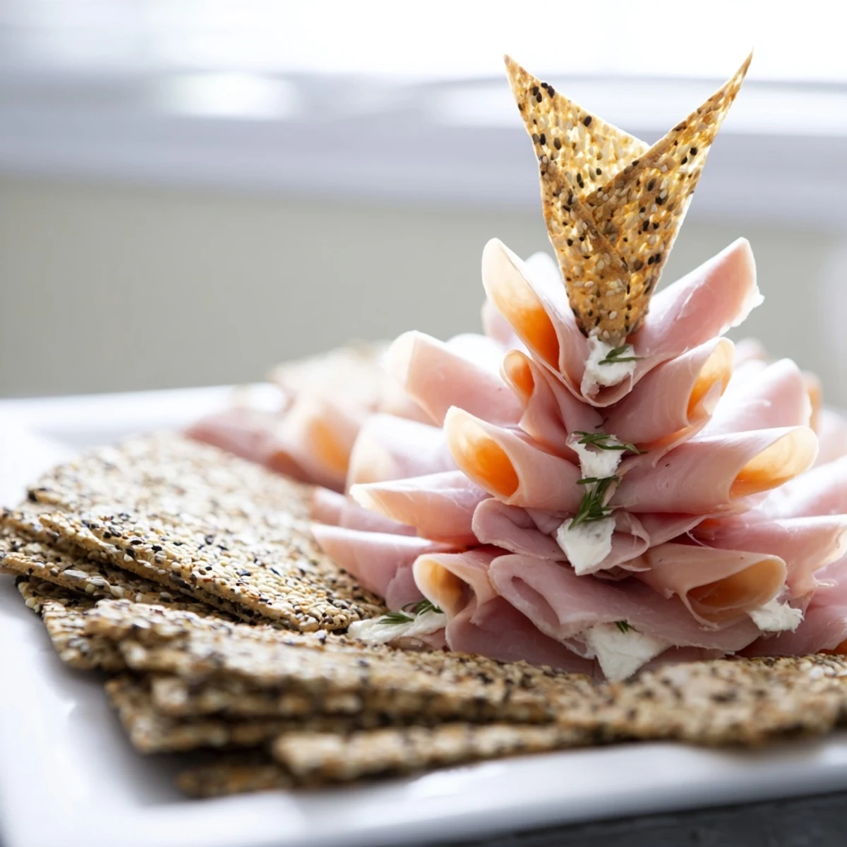 Stunning Paper Crane appetizer presentation: layers of cured meat origami with crisp crackers, ready to serve and enjoy.