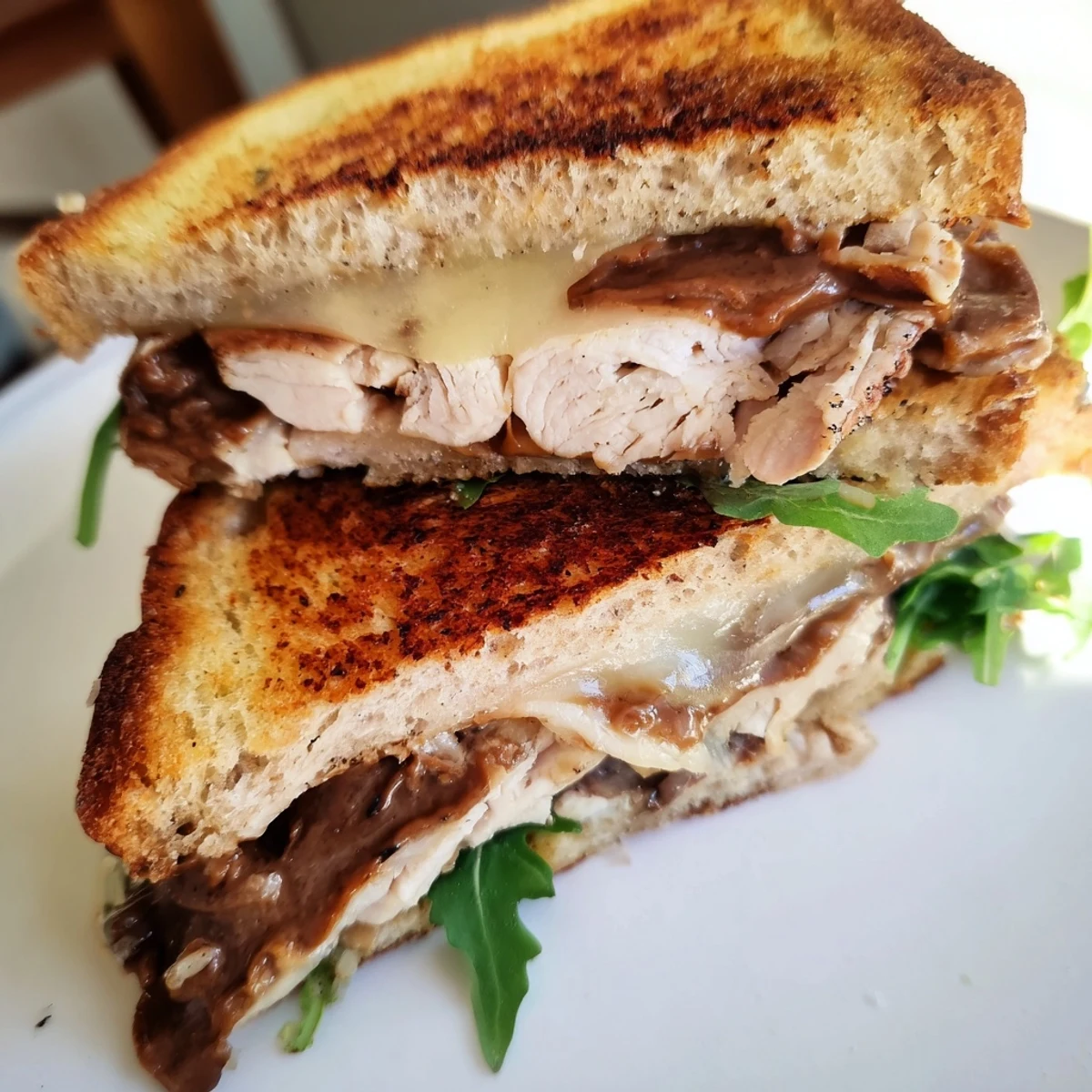 Melting brie cheese and tender chicken layered in this decadent Nutella Grilled Cheese, ready to eat.