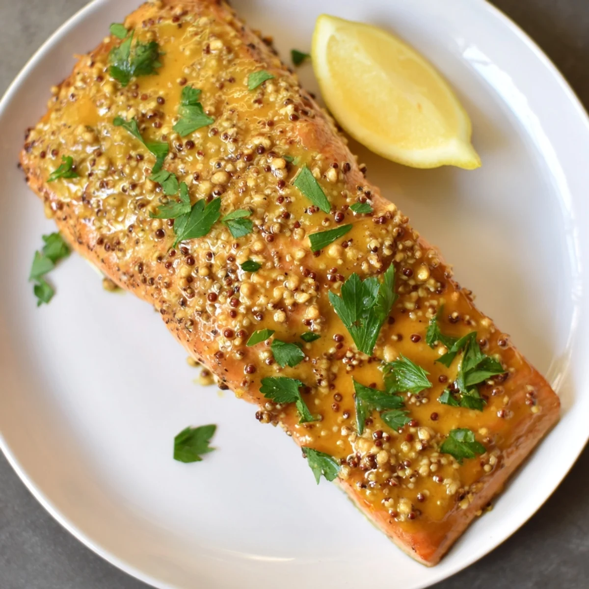 Golden glazed honey mustard salmon, a perfectly cooked and flavorful main course ready to be enjoyed.