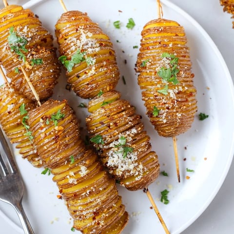 Crispy air-fryer tornado potatoes skewer topped with garlic and paprika seasoning.  