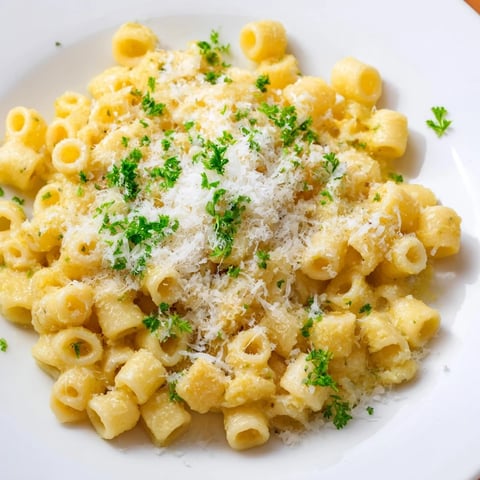Steaming bowl of 15-Minute Garlic Parmesan Pasta, creamy and plated with fresh parsley and extra Parmesan.