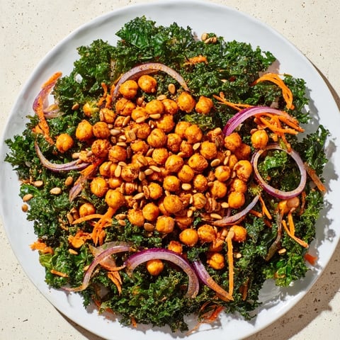 Vibrant kale salad with roasted chickpeas, a complete lunch featuring crunchy chickpeas and fresh kale.