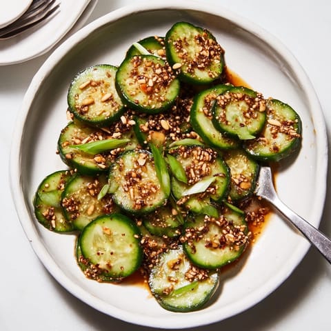 Close-up of Soy Garlic Cucumber Salad, showcasing fresh, marinated cucumbers and colorful scallions.