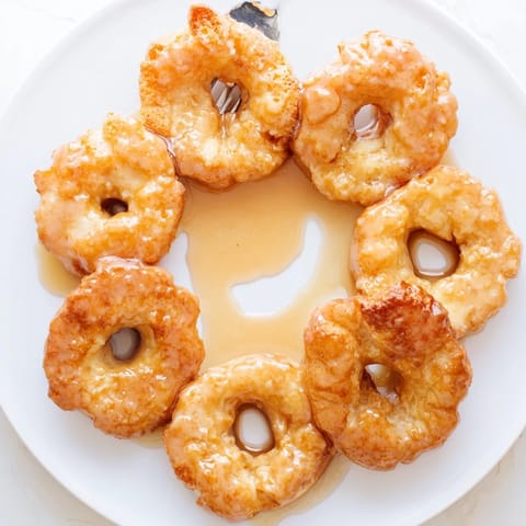Golden brown Flaky Sweet Tea Pancake Donuts, a perfect brunch treat with tea.  