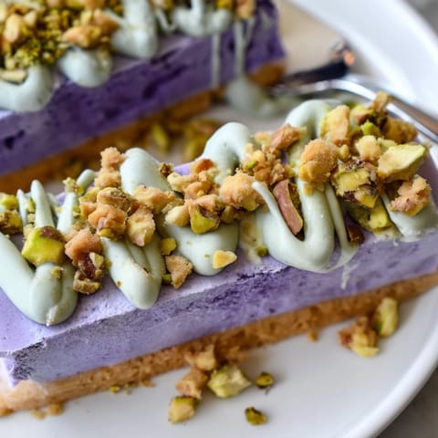 Vibrant ube & pistachio ice cream bars, refreshing dessert layered with unique flavors.  