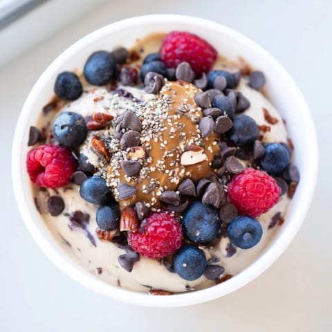 A close-up shot of a homemade Protein Ice Cream Bowl, rich and packed with protein.