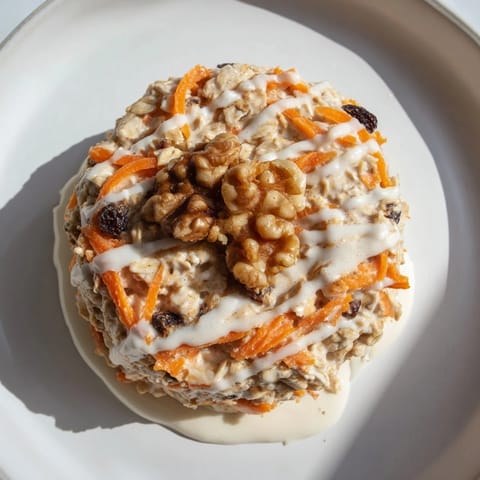 A close-up of Carrot Cake Overnight Oats, showcasing a healthy make-ahead breakfast with warm spices.