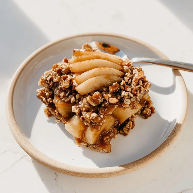 Warm apple slices drenched in sweet maple bourbon caramel and crunchy oat topping.  