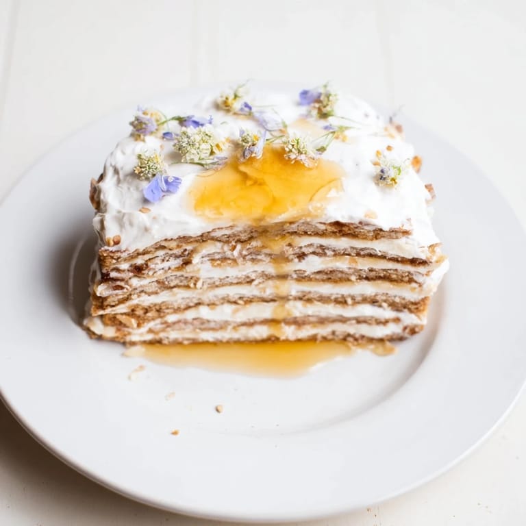 A close-up shot of The Honey-Drip, showcasing the rich cake layers and creamy honey filling.