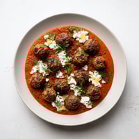 Instant Pot Greek-Style Meatballs with creamy lemon-feta, perfect for a flavorful weeknight meal.