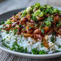 A bowl of Vegetarian Hoppin John featuring tender black-eyed peas, fluffy rice, and fresh herbs.