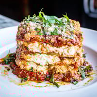 Golden-brown Eggplant Parmesan Lasagna, layered with cheese and a bubbling, rich tomato sauce and ready to slice.